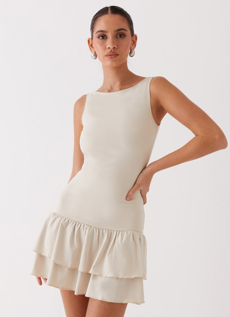 Womens Rhiannon Frill Mini Dress in the colour Ivory in front of a light grey background