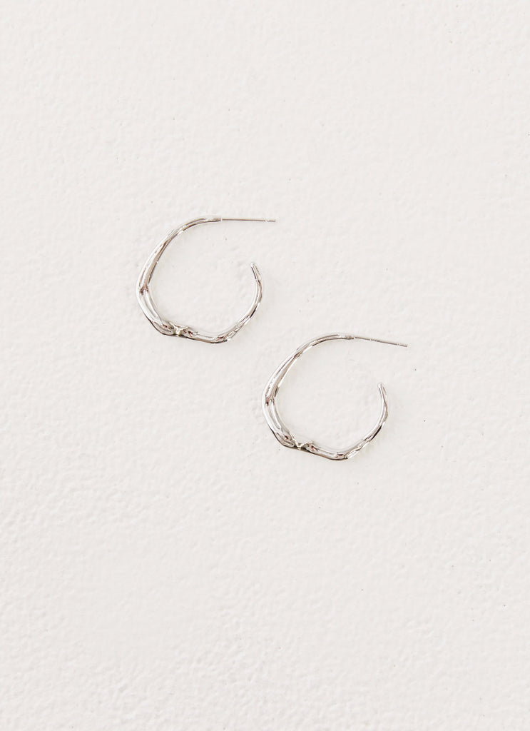 Womens Etta Hoop Earrings in the colour Silver in front of a light grey background