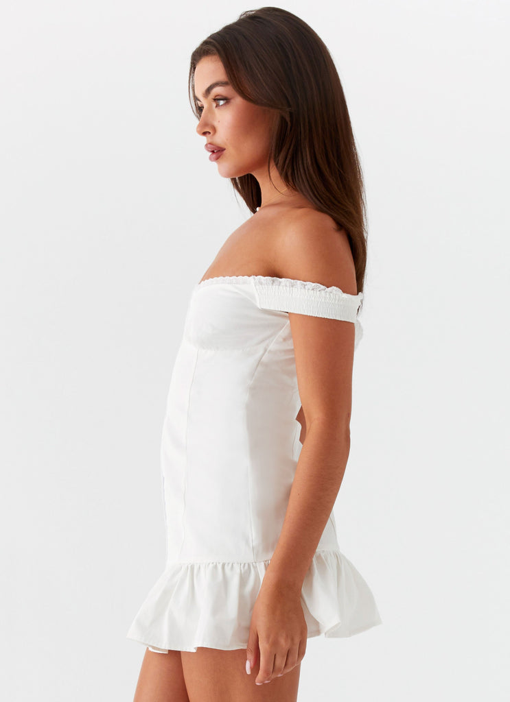 Womens Odessa Frill Mini Dress in the colour White in front of a light grey background