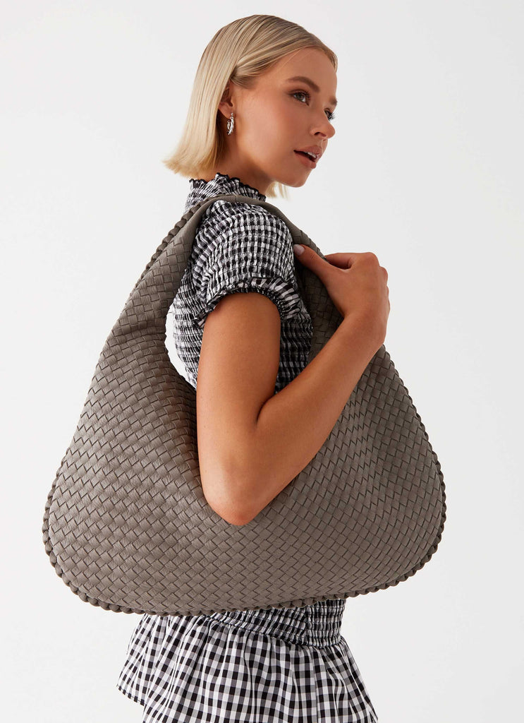 Womens Oriona Woven Handbag in the colour Grey in front of a light grey background