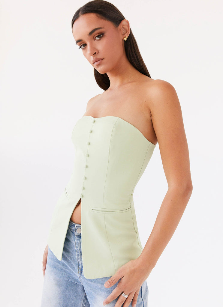 Womens Riveria Tailored Strapless Top in the colour Green Zest in front of a light grey background