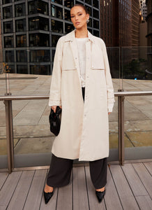 Womens Fill The Void Oversized Trench Coat in the colour Ivory in front of a light grey background