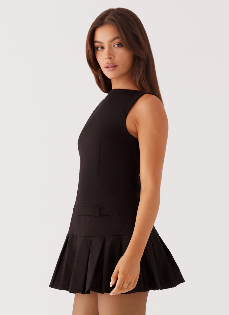 Womens Twilight Pleated Mini Dress in the colour Black in front of a light grey background