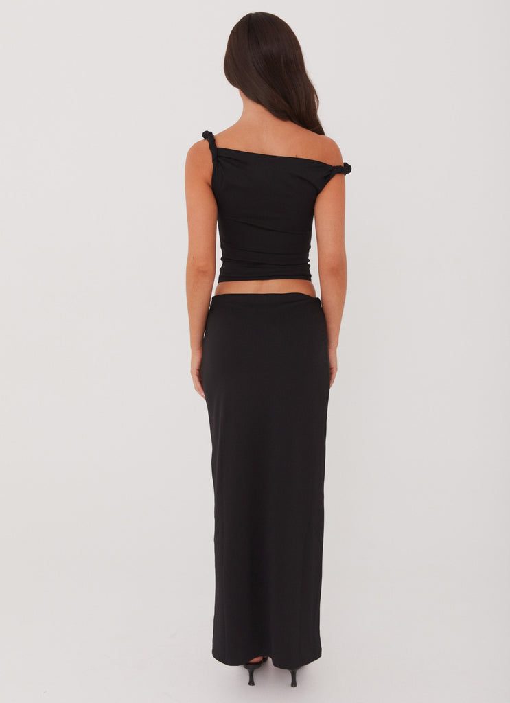 Womens Solace Soul Twist Shoulder Top in the colour Black in front of a light grey background