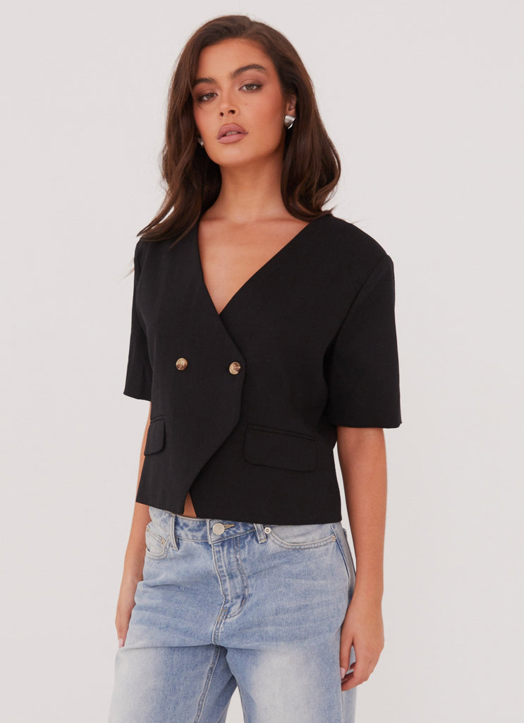 Womens Hacienda Linen Short Sleeve Blazer in the colour Black in front of a light grey background