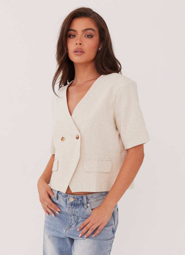 Womens Hacienda Linen Short Sleeve Blazer in the colour Oatmeal in front of a light grey background