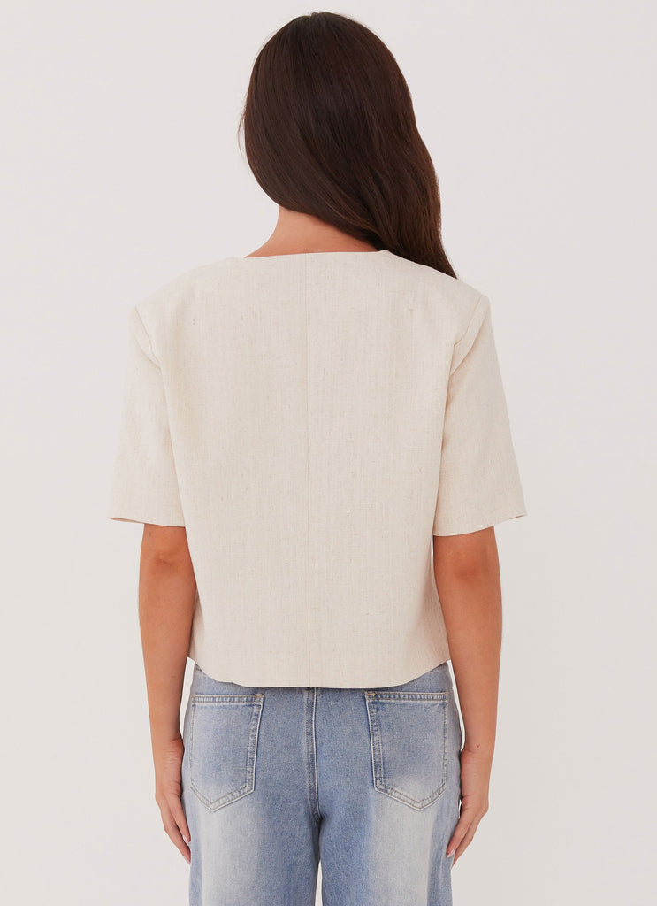 Womens Hacienda Linen Short Sleeve Blazer in the colour Oatmeal in front of a light grey background