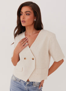 Womens Hacienda Linen Short Sleeve Blazer in the colour Oatmeal in front of a light grey background