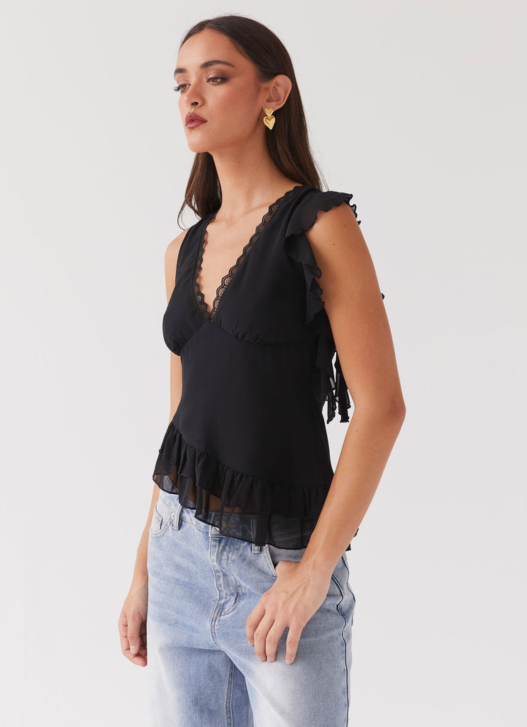 Womens Empress Frill Trim Top in the colour Black in front of a light grey background