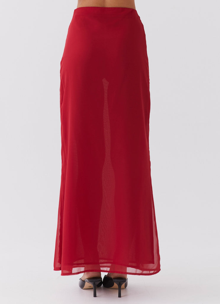 Womens Nightfall Maxi Skirt in the colour Rouge Red in front of a light grey background