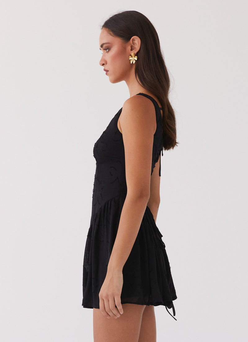 Womens Evelyn Mini Dress in the colour Black in front of a light grey background