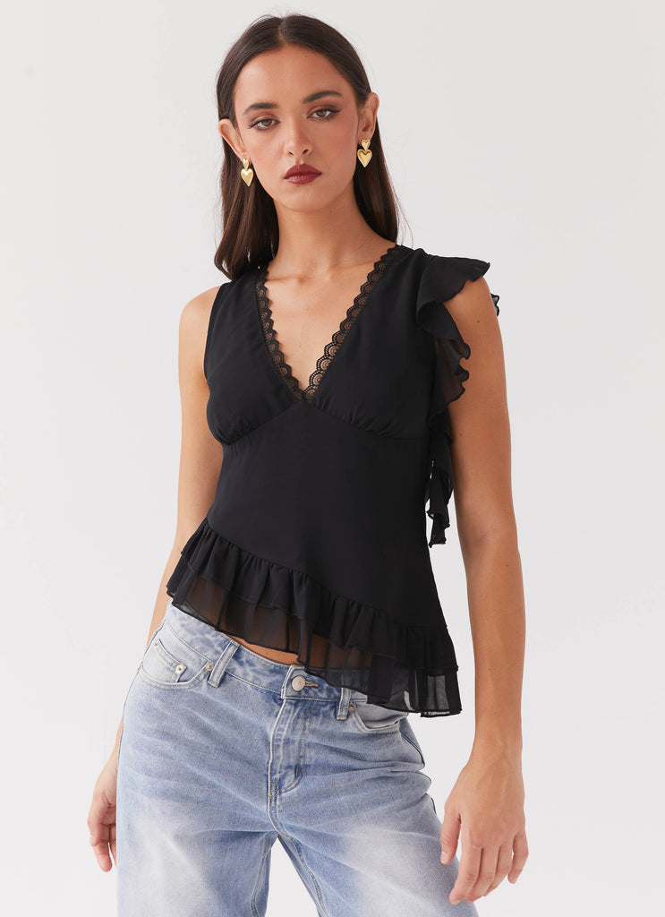 Womens Empress Frill Trim Top in the colour Black in front of a light grey background