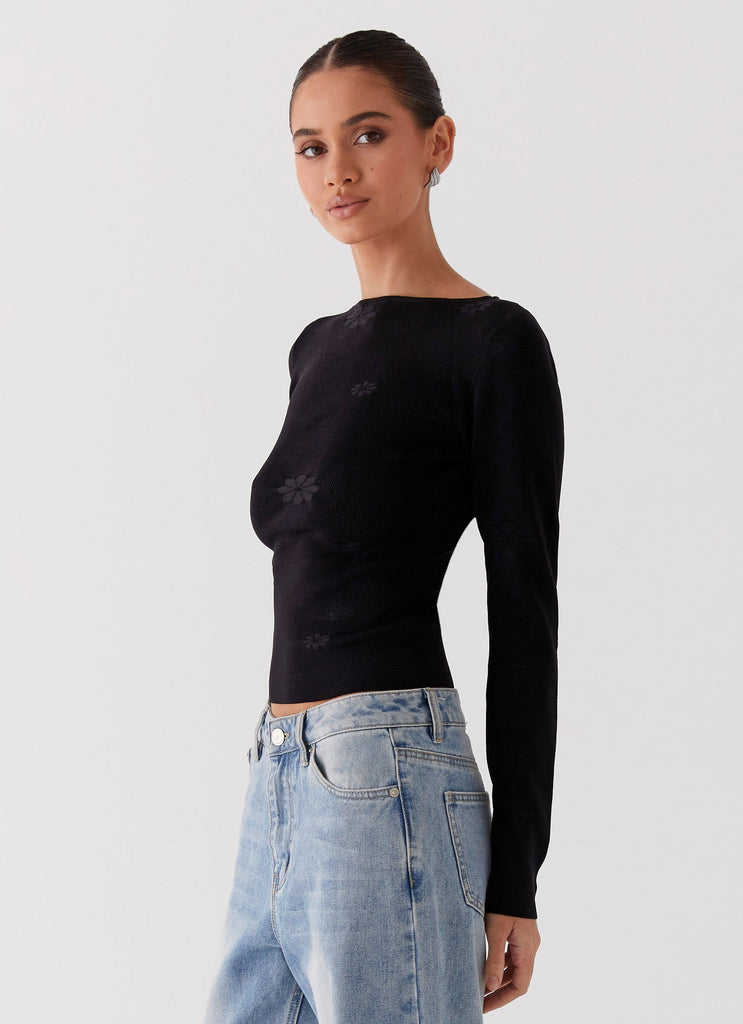 Womens Dandelion Long Sleeve Knit Top in the colour Black in front of a light grey background