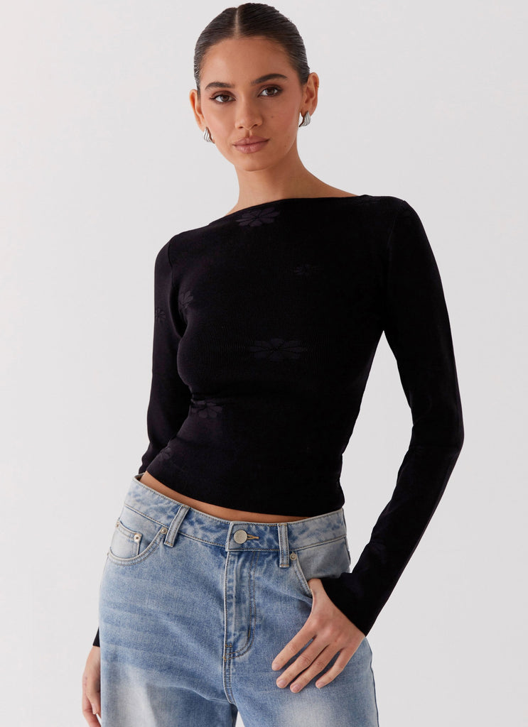 Womens Dandelion Long Sleeve Knit Top in the colour Black in front of a light grey background