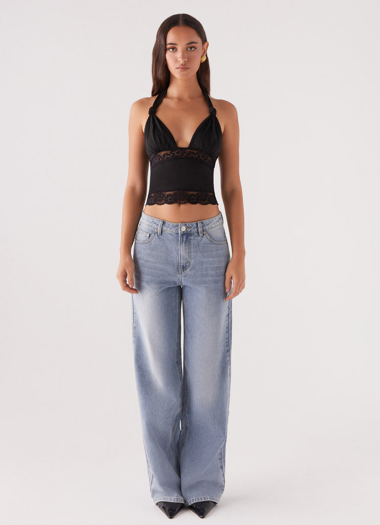 Womens Ocean Plunge Lace Trim Top in the colour Black in front of a light grey background