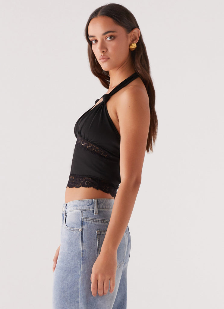 Womens Ocean Plunge Lace Trim Top in the colour Black in front of a light grey background