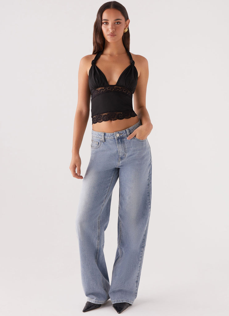 Womens Ocean Plunge Lace Trim Top in the colour Black in front of a light grey background