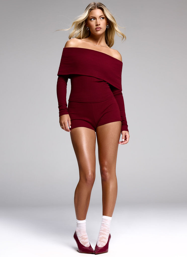 Womens Spectate Mini Shorts in the colour Maroon in front of a light grey background