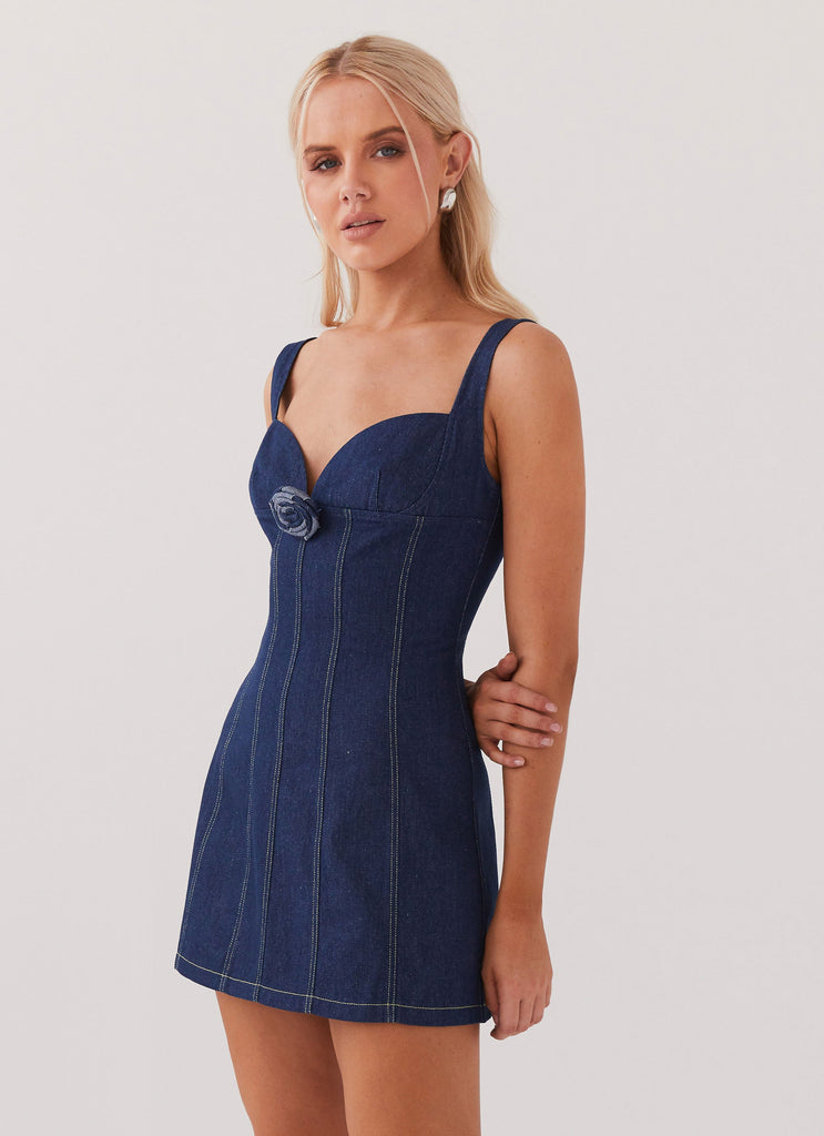 Womens Rosalia Denim Mini Dress in the colour Indigo in front of a light grey background