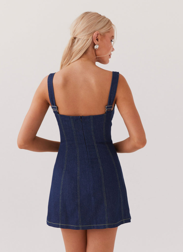 Womens Rosalia Denim Mini Dress in the colour Indigo in front of a light grey background