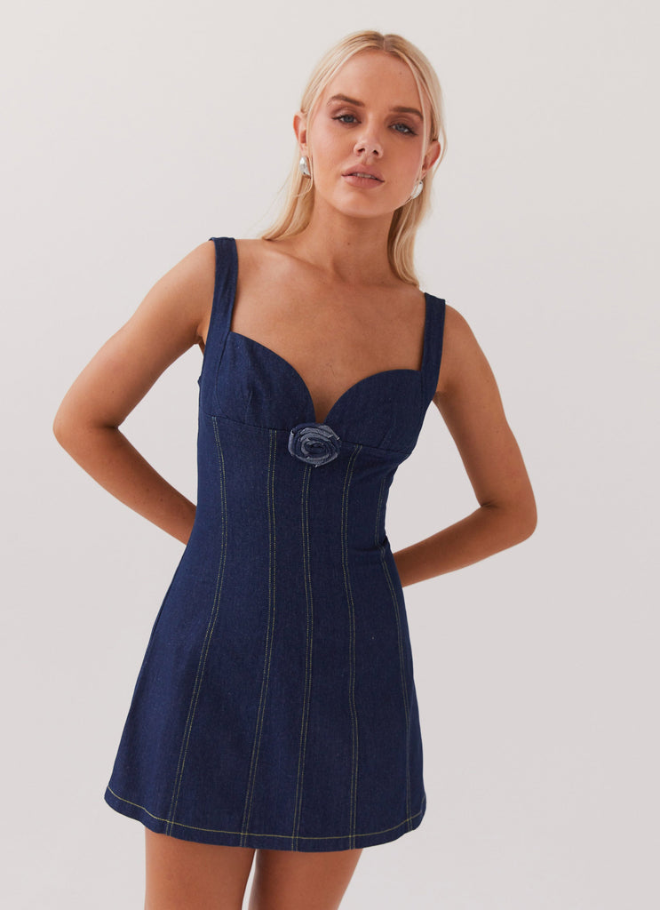 Womens Rosalia Denim Mini Dress in the colour Indigo in front of a light grey background