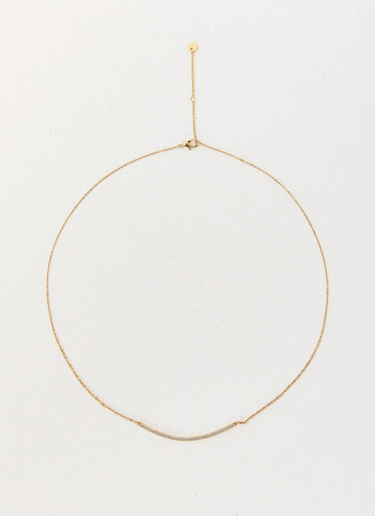 Womens Sweet Harmony Pendant Necklace in the colour Gold in front of a light grey background