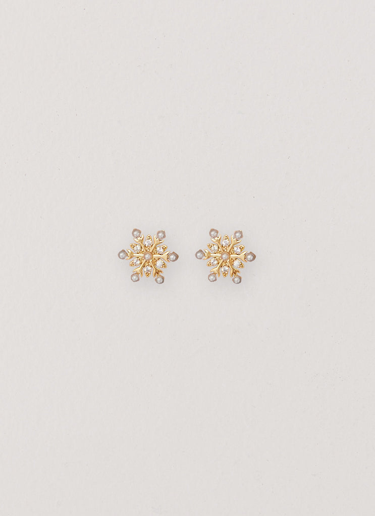 Womens Crystal Snowflake Earring in the colour Gold in front of a light grey background