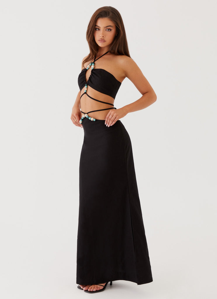 Womens Neveah Beaded Maxi Skirt in the colour Black in front of a light grey background