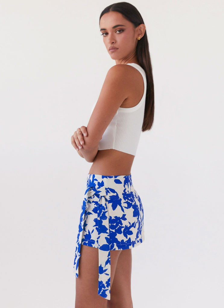 Womens Steal Away Linen Wrap Skirt in the colour Blue Floral in front of a light grey background