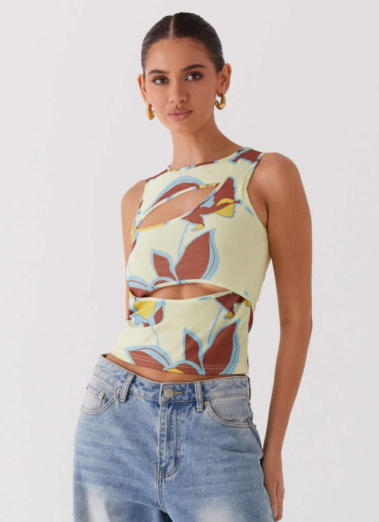 Womens Beyond Cut Out Mesh Top in the colour Primrose in front of a light grey background