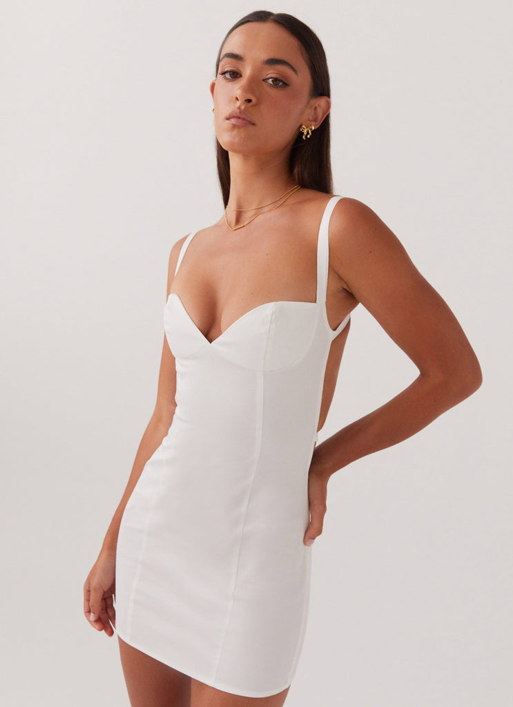 Womens Naomi Backless Mini Dress in the colour White in front of a light grey background