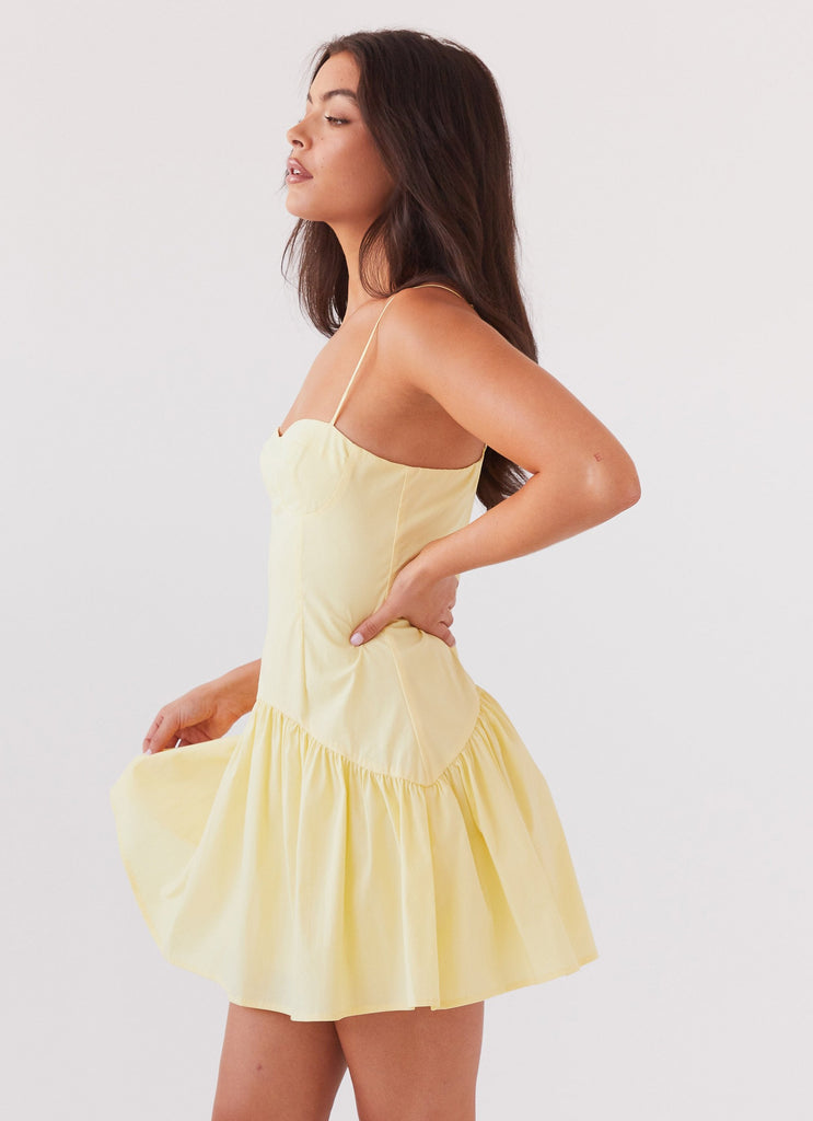 Womens Endless Summer Mini Dress in the colour Canary in front of a light grey background