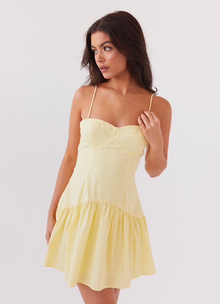 Womens Endless Summer Mini Dress in the colour Canary in front of a light grey background