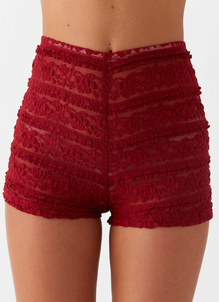 Womens Desert Isle Mini Shorts in the colour Red in front of a light grey background