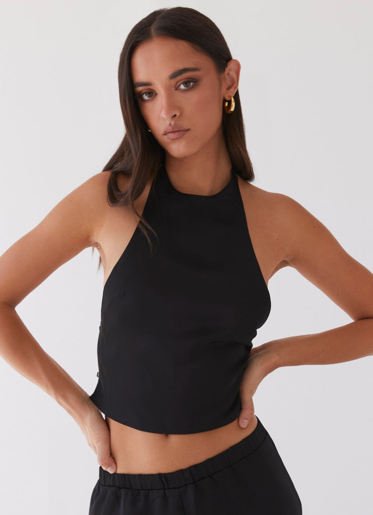 Womens Bree Satin Halterneck Top in the colour Black in front of a light grey background