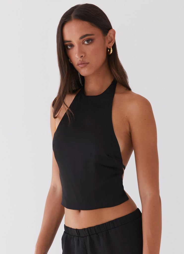 Womens Bree Satin Halterneck Top in the colour Black in front of a light grey background