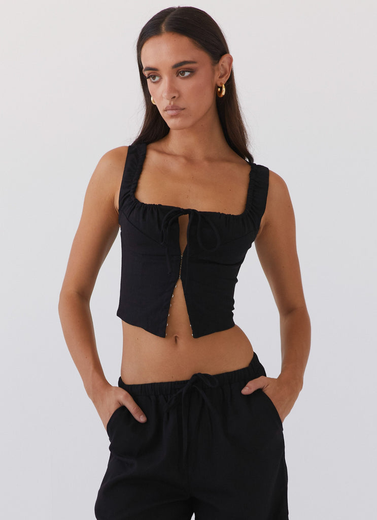 Womens Take Me Away Corset Top in the colour Black in front of a light grey background