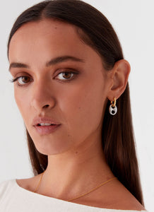 Womens Vacations Two Tone Earrings in the colour Gold/Silver in front of a light grey background