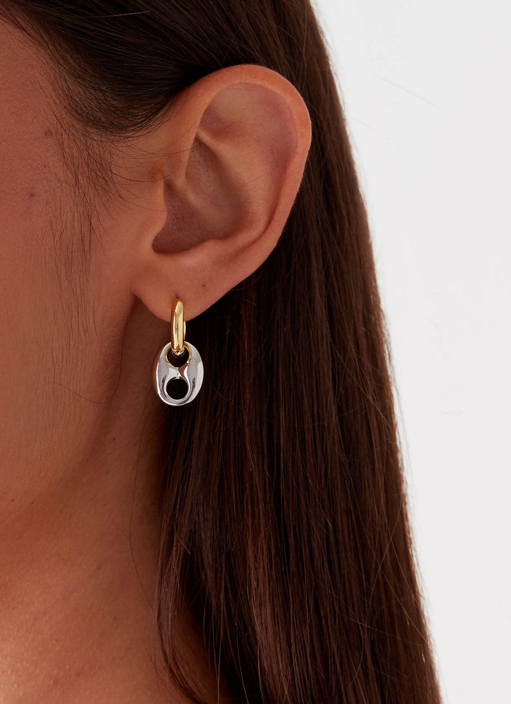 Womens Vacations Two Tone Earrings in the colour Gold/Silver in front of a light grey background