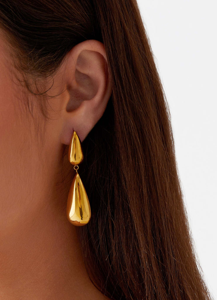 Womens Stay True Earrings in the colour Gold in front of a light grey background