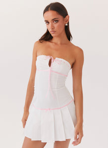 Womens Candy Coated Bustier Mini Dress in the colour Pink Ribbon in front of a light grey background