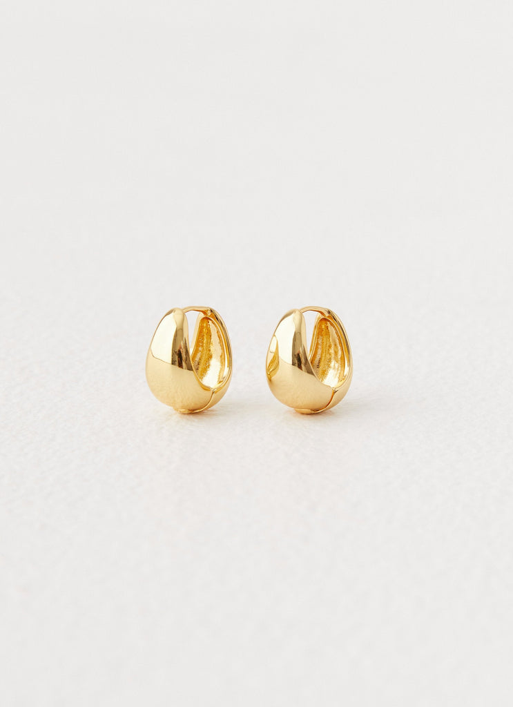 Womens Dome Teardrop Earrings in the colour Gold in front of a light grey background