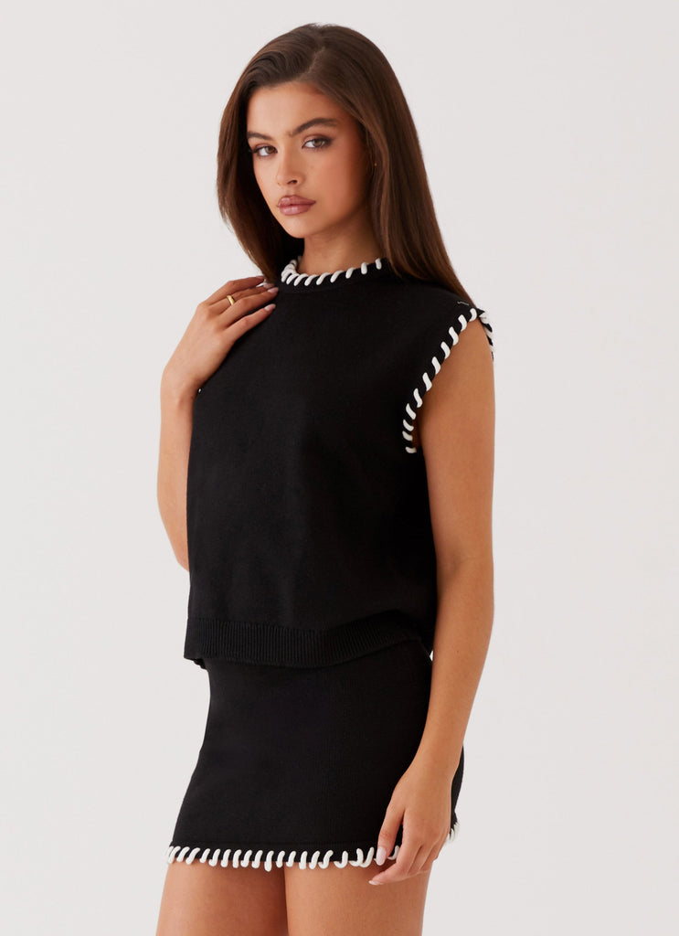 Womens Let's Get Loud Knit Top in the colour Black in front of a light grey background