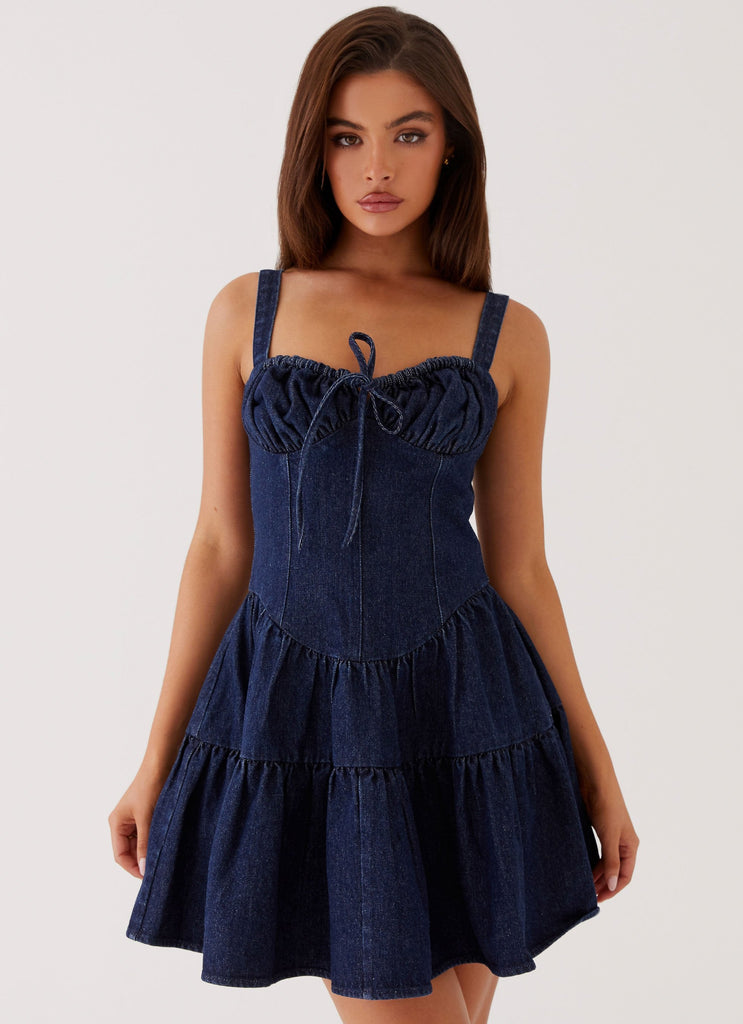 Womens Lucie Denim Mini Dress in the colour Indigo in front of a light grey background