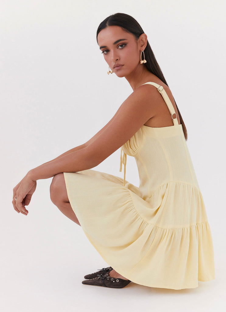 Womens Lucie Linen Mini Dress in the colour Yellow in front of a light grey background