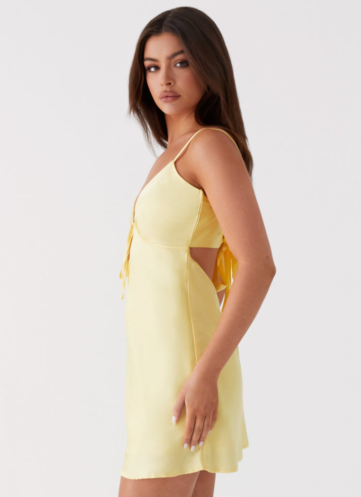 Womens Flora Satin Mini Dress in the colour Yellow in front of a light grey background