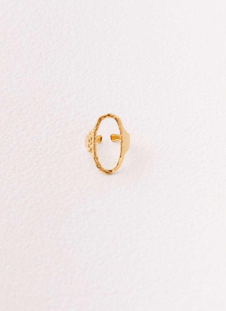 Womens Kyra Oval Textured Ring in the colour Gold in front of a light grey background