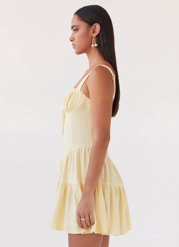 Womens Lucie Linen Mini Dress in the colour Yellow in front of a light grey background