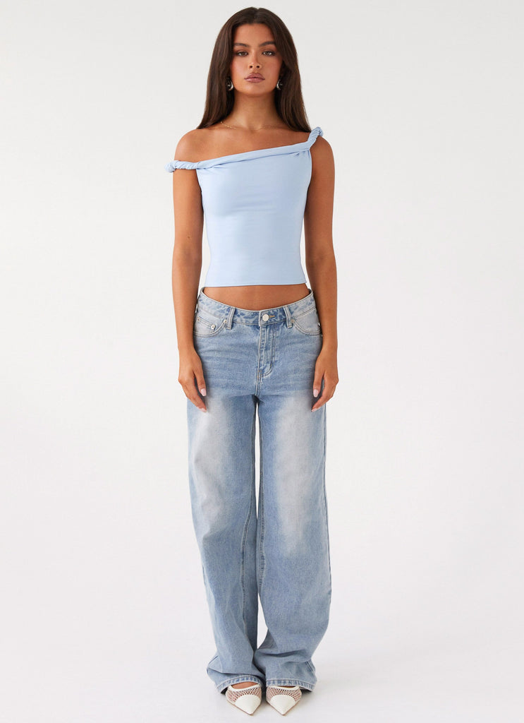 Womens Solace Soul Twist Shoulder Top in the colour Baby Blue in front of a light grey background