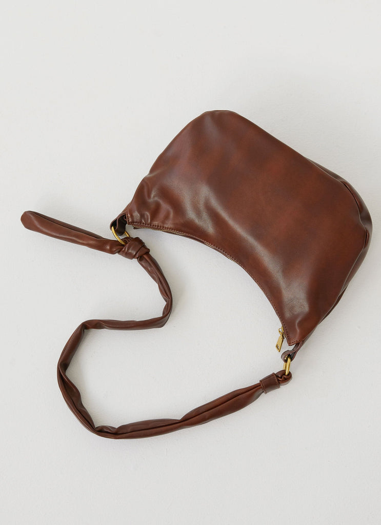 Womens Tana Shoulder Bag in the colour Brown in front of a light grey background